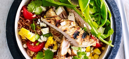 Red rice bowl with grilled corn, lime and garlic turkey and feta