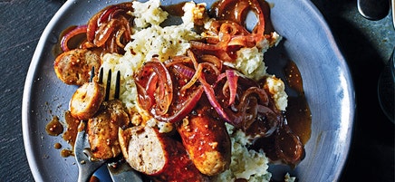 Sausages with cauliflower mash and red onions