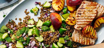 Griddled pork with freekeh & nectarine salad