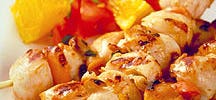 Orange-grilled scallops with mint and tomatoes