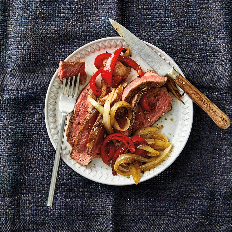 Grilled Rib Eye Steaks with Roasted Peppers & Onions
