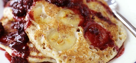 Whole-grain banana pancakes with blackberry syrup
