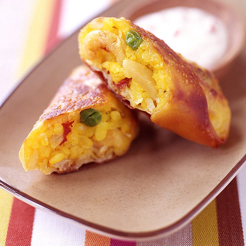 Photo of Paella egg rolls with roasted pepper cream sauce by WW
