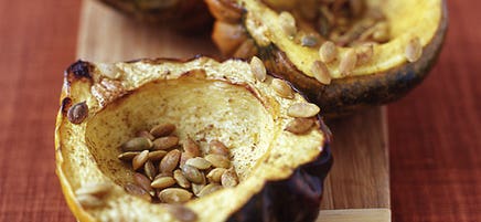 Roasted acorn squash with cumin and pumpkin seeds