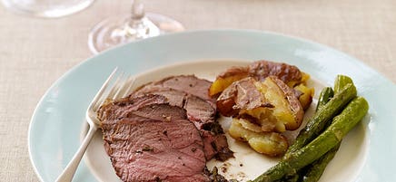 Roasted lamb with smashed potatoes and asparagus