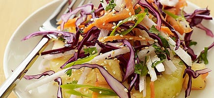 Asian slaw over sliced pineapple