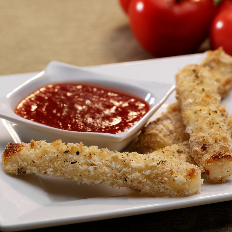 Baked mozzarella sticks with spicy tomato dipping sauce