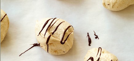 Chocolate-drizzled meringues