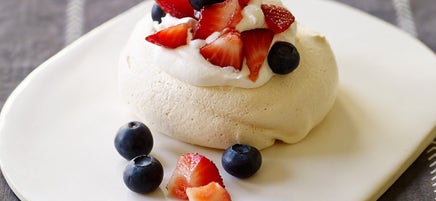 Mini Pavlovas with whipped cream and berries