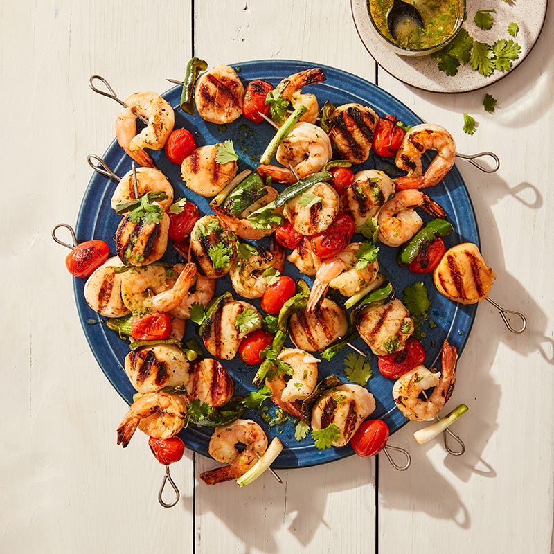 Grilled scallop and shrimp skewers with mojo sauce