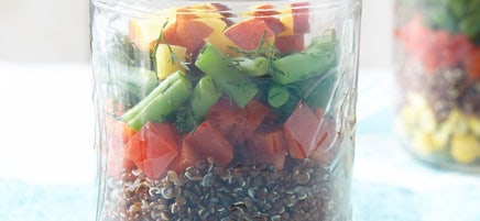 Layered mason jar quinoa and veggie salad