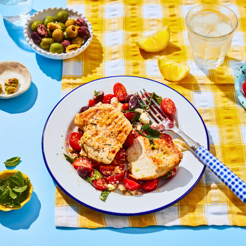 Photo of Lemon chicken with tomato, olive, and feta salad by WW