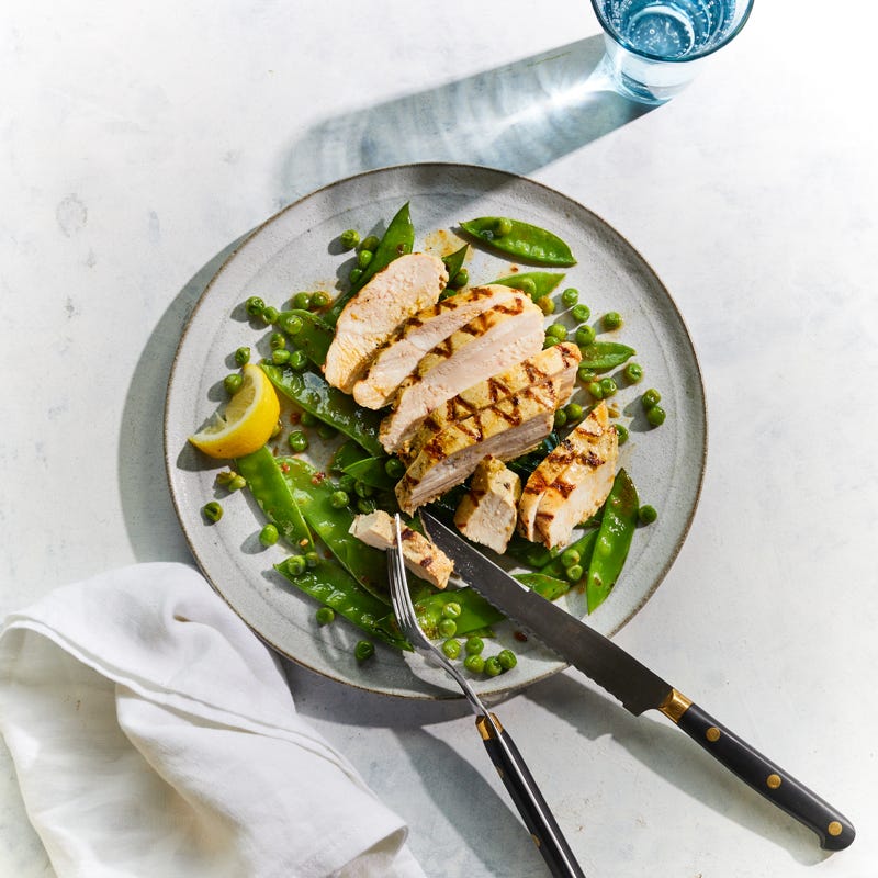 Grilled lemon chicken with spring pea sauté