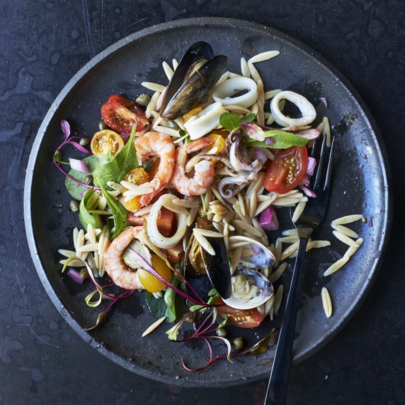 Seafood salad with tomatoes and orzo