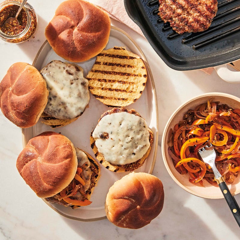 Fennel-sage pork burgers with provolone and sautéed peppers