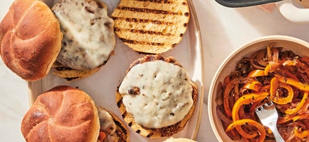 Fennel-sage pork burgers with provolone and sautéed peppers