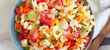 Italian pasta salad with tomatoes and artichoke hearts