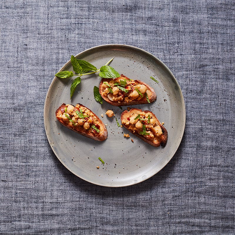 Photo of Crostini with smashed chickpeas, sun-dried tomatoes and mint by WW