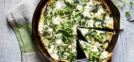 Skillet spinach, pea shoot, and spring herb pie