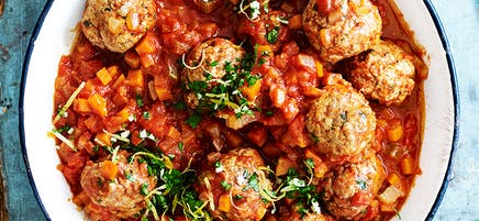 Pork and veal meatballs on polenta with gremolata
