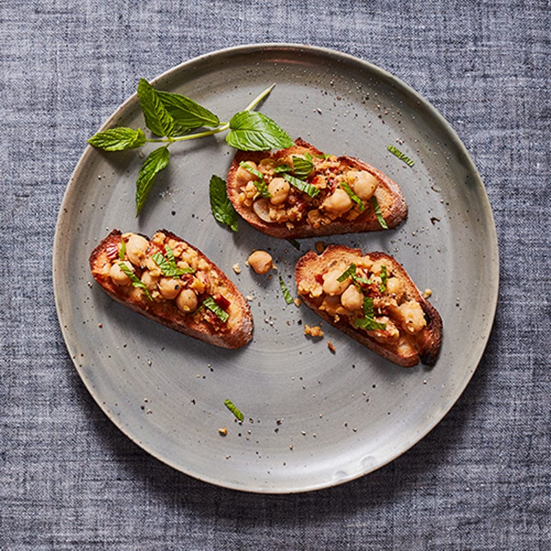 Photo of Crostini with Smashed Chickpeas, Sun-Dried Tomatoes and Mint by WW