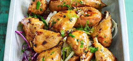 Maple and mustard chicken drumsticks with cabbage and apple slaw
