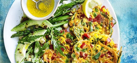 Rainbow fritters with avocado and asparagus salad
