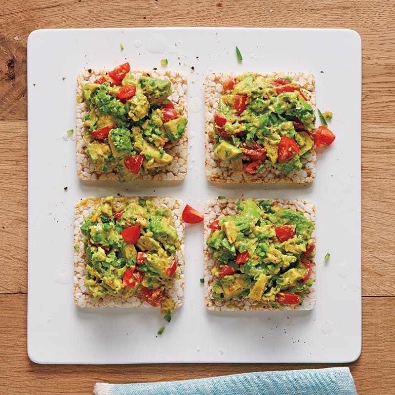 Chunky guacamole-topped rice cakes