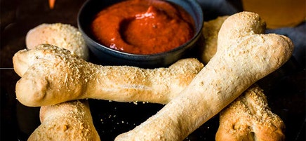 Breadstick bones with pizza dipping sauce