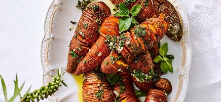 Hasselback sweet potatoes with garlic and herb spread