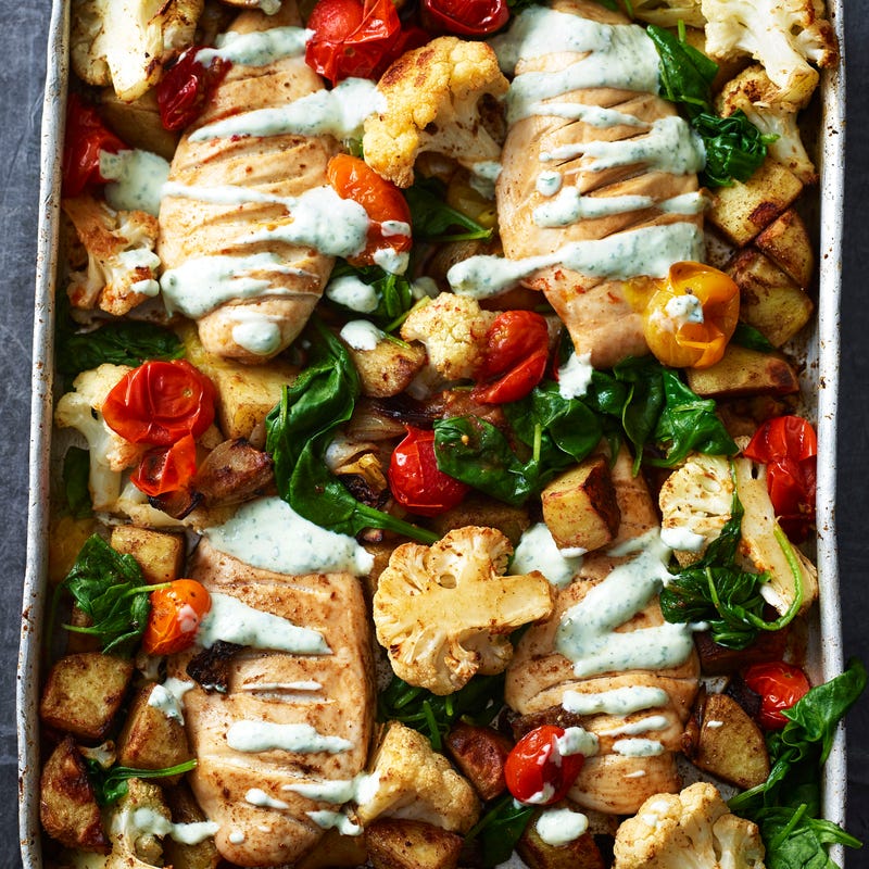Photo of Indian-style chicken traybake with potatoes, cauliflower & mint yogurt by WW