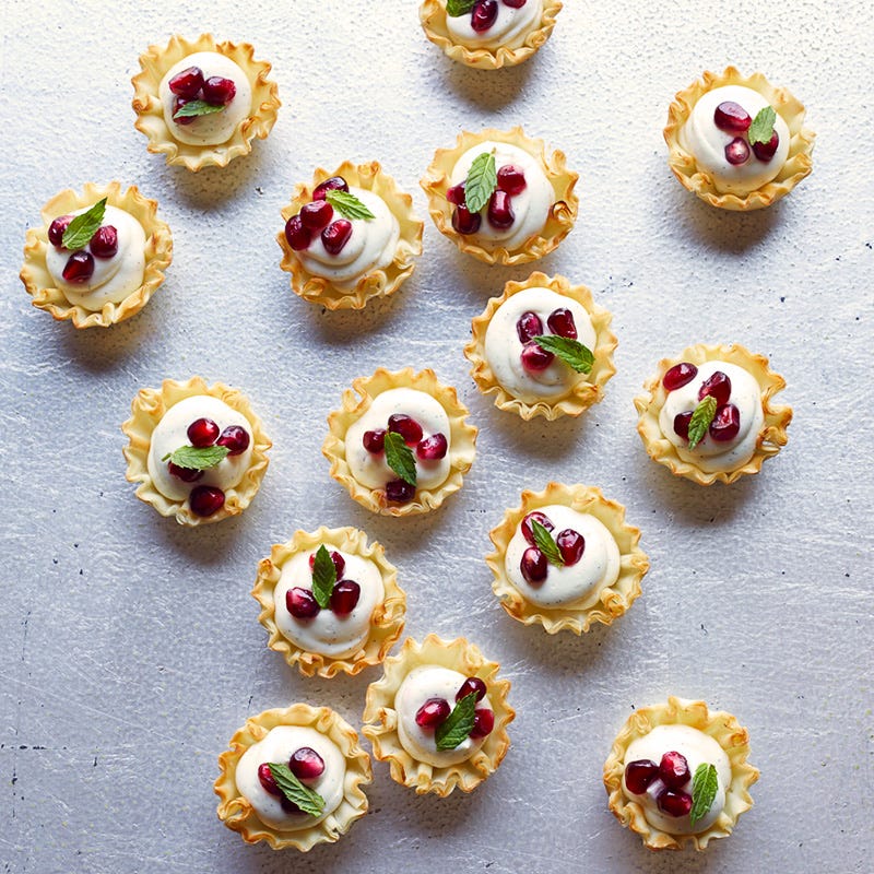 Photo of Mini vanilla bean-pomegranate cheesecake tarts by WW