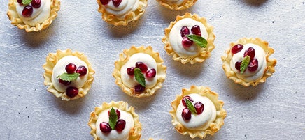 Mini vanilla bean-pomegranate cheesecake tarts