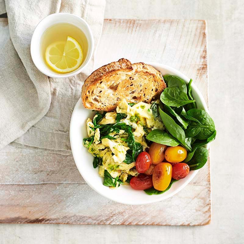 Green eggs with blistered tomatoes