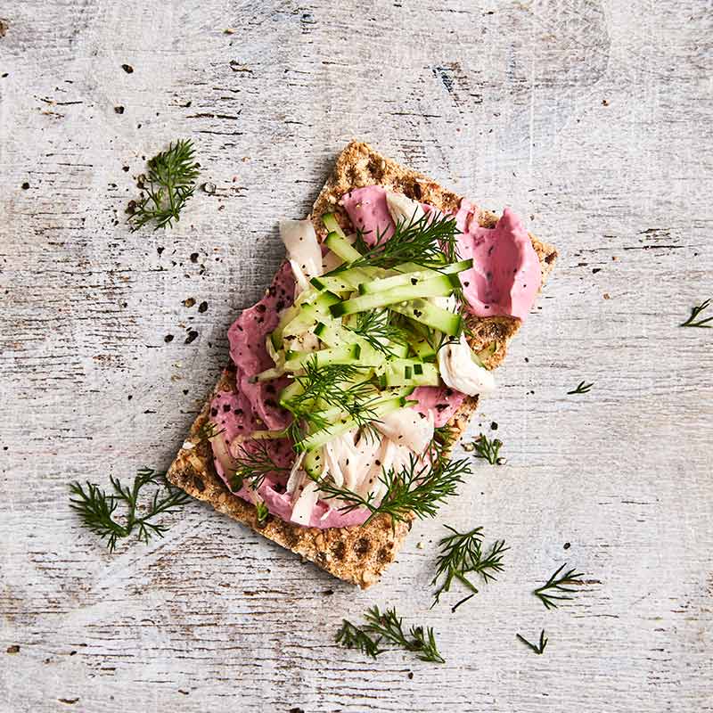 Crispbread topped with beetroot dip and chicken
