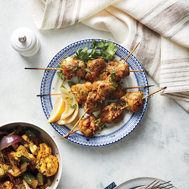 Tandoori chicken skewers with roasted vegetables