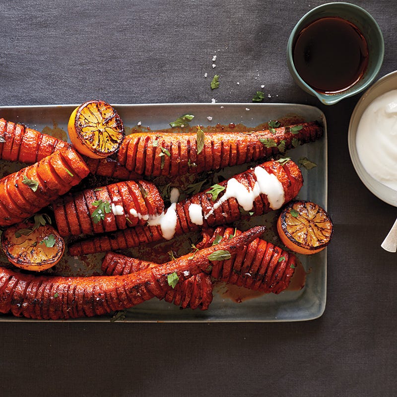 Photo of Hasselback carrots with smoked paprika, roasted lemon, and yogurt sauce by WW
