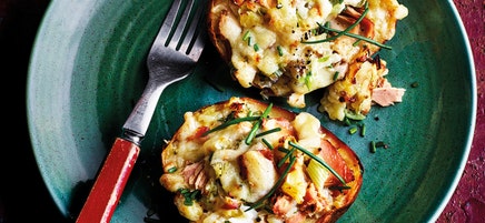 Baked potato with tuna melt topping