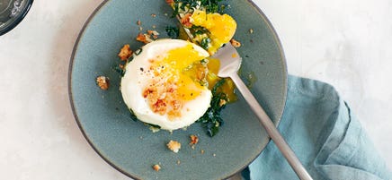 Baked eggs with kale Caesar salad