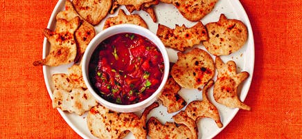 Spooky tortilla crisps with tomato salsa