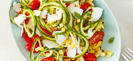 Zucchini noodle salad with tomatoes corn and basil