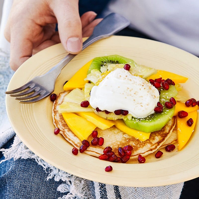 Coconut pancakes with tropical fruit