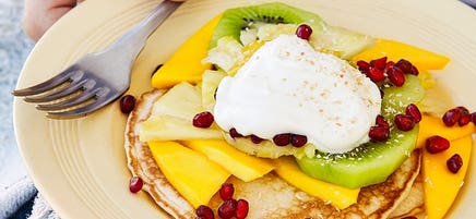 Coconut pancakes with tropical fruit