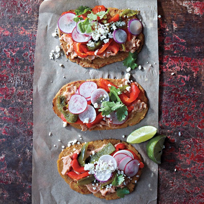 Huaraches with refried beans and peppers