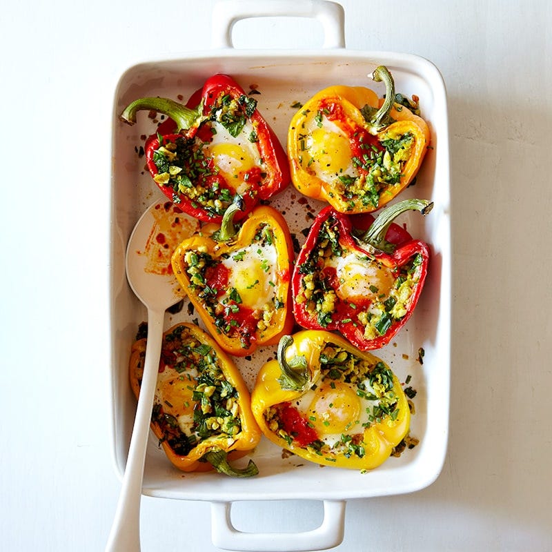 Baked capsicums with chickpeas, eggs and harissa