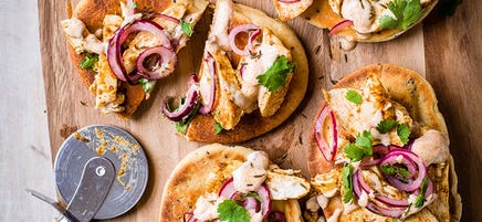 Chicken tikka and pickled onion pizzas