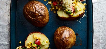 Baked potatoes with charred corn salsa