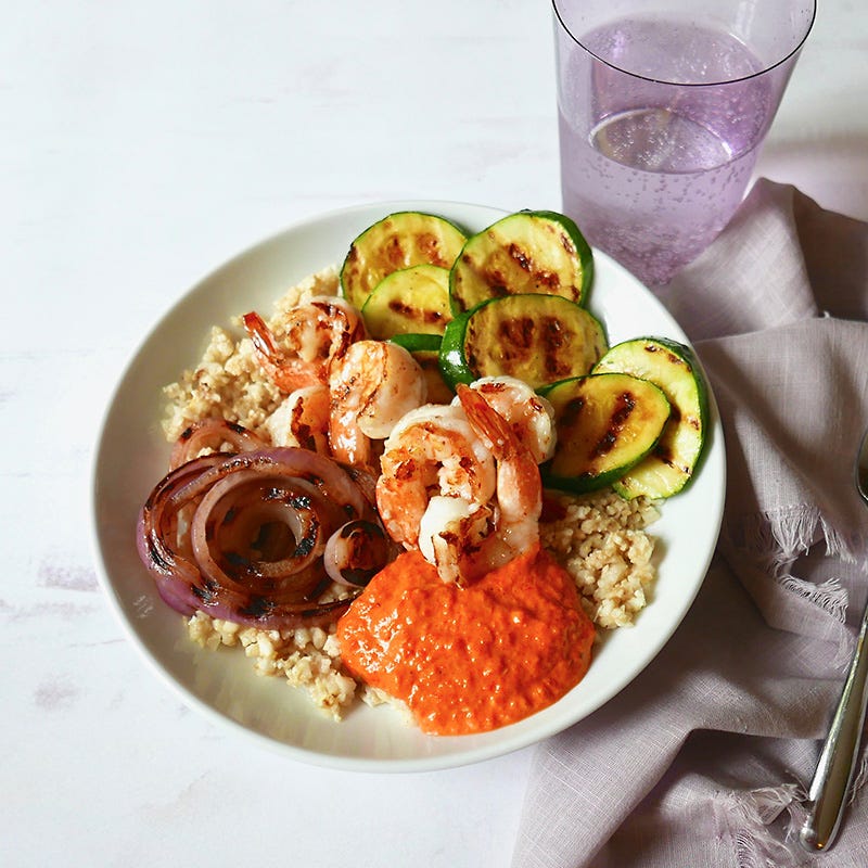 Cauliflower rice bowl with grilled shrimp & romesco