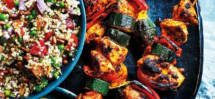 Harissa chicken skewers with burghul salad