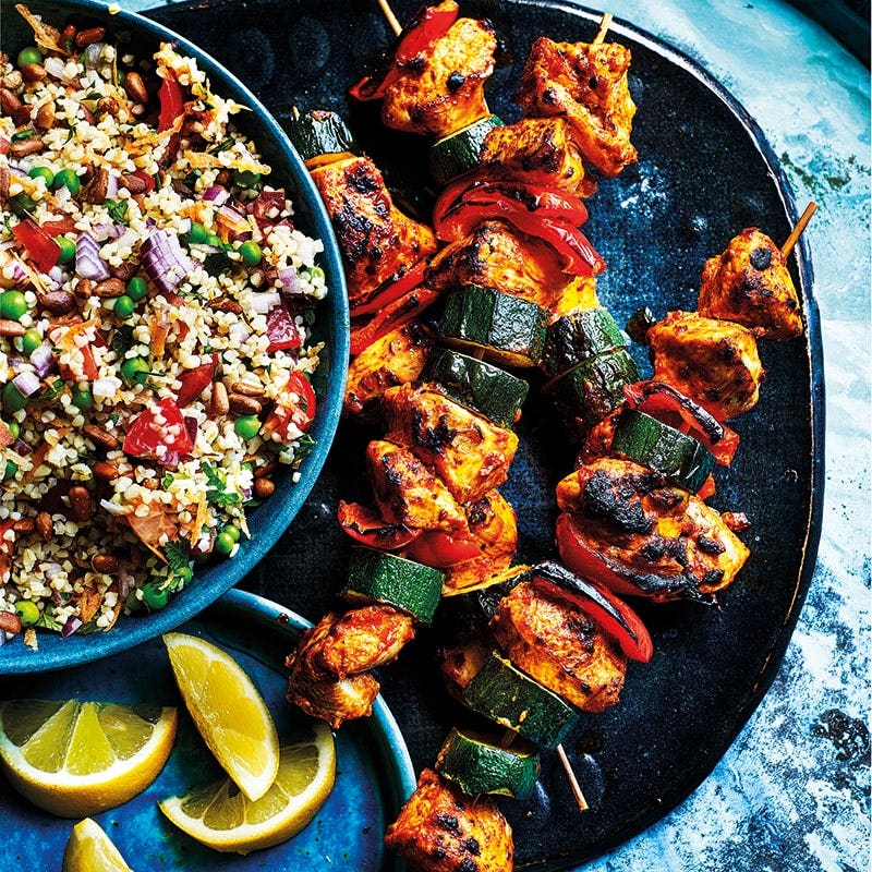 Harissa chicken skewers with burghul salad